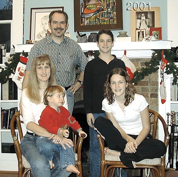 2001 - The fireplace looks like this every Christmas, 
with the same plastic garland.