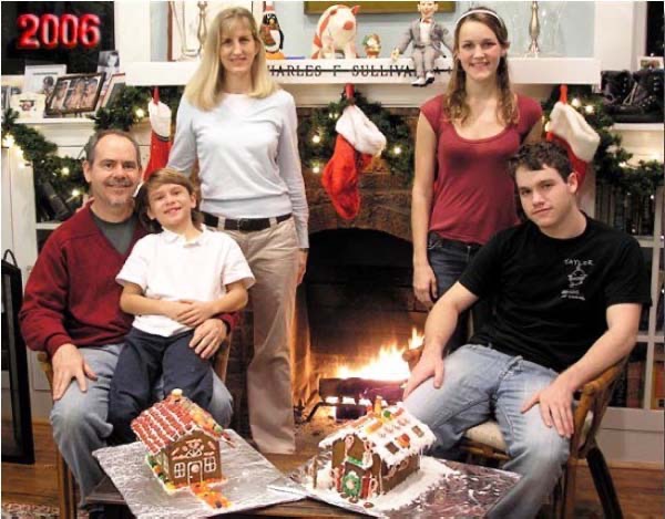 2006 - Back to the fireplace, with painstakingly constructed gingerbread houses. 
By the time we tried to eat them, they tasted like QuickCrete.